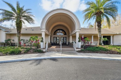 Stunning 4-bedroom, 3-bath pool home with spa on a serene pond on Crescent Oaks Country Club in Florida - for sale on GolfHomes.com, golf home, golf lot