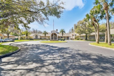 Stunning 4-bedroom, 3-bath pool home with spa on a serene pond on Crescent Oaks Country Club in Florida - for sale on GolfHomes.com, golf home, golf lot