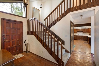 Tucked among mature trees and backing to the Rivermont golf on Rivermont Golf and Country Club in Georgia - for sale on GolfHomes.com, golf home, golf lot