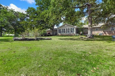 Enjoy a peaceful, park-like setting in this conveniently located on Harrison Country Club in Arkansas - for sale on GolfHomes.com, golf home, golf lot