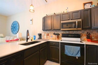 This lovely condo located directly across from White Lake Oaks on White Lake Oaks Golf Course in Michigan - for sale on GolfHomes.com, golf home, golf lot