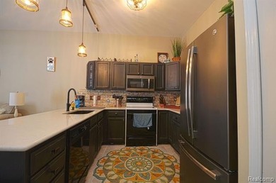 This lovely condo located directly across from White Lake Oaks on White Lake Oaks Golf Course in Michigan - for sale on GolfHomes.com, golf home, golf lot