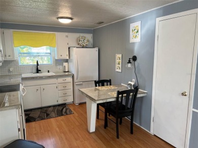This stunning home, showcasing premium upgrades, is a on Palm Hill Golf Club in Florida - for sale on GolfHomes.com, golf home, golf lot