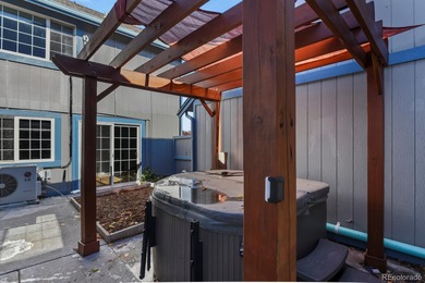 Beautifully updated townhome overlooking the 11th-hole fairway on Golf Club At Heather Ridge in Colorado - for sale on GolfHomes.com, golf home, golf lot