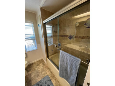 This stunning home, showcasing premium upgrades, is a on Palm Hill Golf Club in Florida - for sale on GolfHomes.com, golf home, golf lot