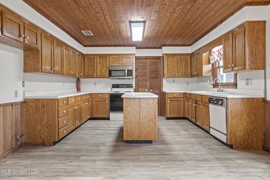 Beautiful Southern style home nestled on a serene 1 1/2 acre on Mississippi National Golf Course in Mississippi - for sale on GolfHomes.com, golf home, golf lot