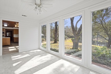 Beautiful Southern style home nestled on a serene 1 1/2 acre on Mississippi National Golf Course in Mississippi - for sale on GolfHomes.com, golf home, golf lot