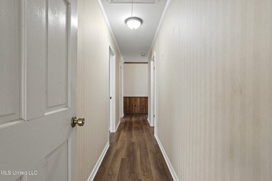 Beautiful Southern style home nestled on a serene 1 1/2 acre on Mississippi National Golf Course in Mississippi - for sale on GolfHomes.com, golf home, golf lot