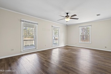 Beautiful Southern style home nestled on a serene 1 1/2 acre on Mississippi National Golf Course in Mississippi - for sale on GolfHomes.com, golf home, golf lot