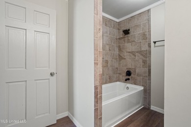 Beautiful Southern style home nestled on a serene 1 1/2 acre on Mississippi National Golf Course in Mississippi - for sale on GolfHomes.com, golf home, golf lot