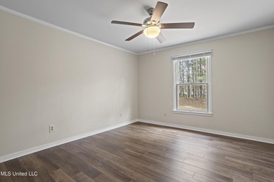 Beautiful Southern style home nestled on a serene 1 1/2 acre on Mississippi National Golf Course in Mississippi - for sale on GolfHomes.com, golf home, golf lot