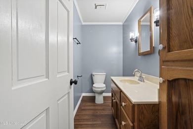 Beautiful Southern style home nestled on a serene 1 1/2 acre on Mississippi National Golf Course in Mississippi - for sale on GolfHomes.com, golf home, golf lot