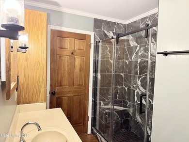 Beautiful Southern style home nestled on a serene 1 1/2 acre on Mississippi National Golf Course in Mississippi - for sale on GolfHomes.com, golf home, golf lot