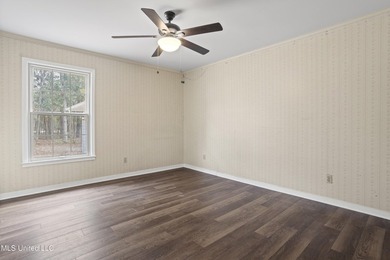 Beautiful Southern style home nestled on a serene 1 1/2 acre on Mississippi National Golf Course in Mississippi - for sale on GolfHomes.com, golf home, golf lot