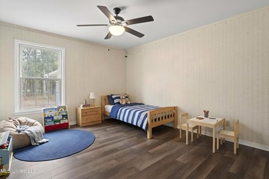 Beautiful Southern style home nestled on a serene 1 1/2 acre on Mississippi National Golf Course in Mississippi - for sale on GolfHomes.com, golf home, golf lot