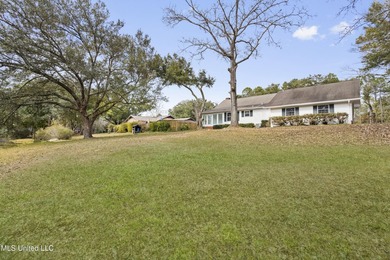 Beautiful Southern style home nestled on a serene 1 1/2 acre on Mississippi National Golf Course in Mississippi - for sale on GolfHomes.com, golf home, golf lot