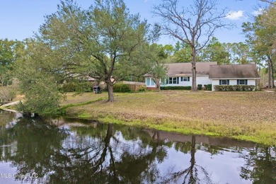 Beautiful Southern style home nestled on a serene 1 1/2 acre on Mississippi National Golf Course in Mississippi - for sale on GolfHomes.com, golf home, golf lot