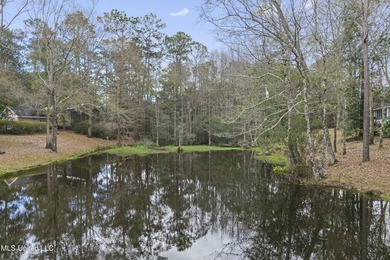 Beautiful Southern style home nestled on a serene 1 1/2 acre on Mississippi National Golf Course in Mississippi - for sale on GolfHomes.com, golf home, golf lot