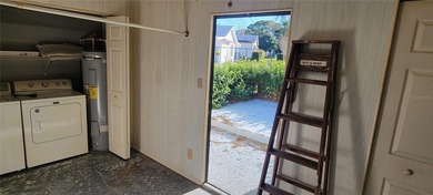 Welcome home to this charming 940 sq. ft., 2-bedroom, 1-bath on Orange Blossom Hills Golf and Country Club in Florida - for sale on GolfHomes.com, golf home, golf lot