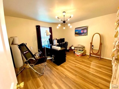 Welcome to this beautifully maintained 4-bedroom, 3-bathroom on Desert Hawk At Pueblo West in Colorado - for sale on GolfHomes.com, golf home, golf lot