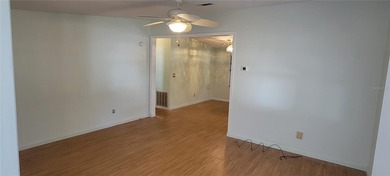 Welcome home to this charming 940 sq. ft., 2-bedroom, 1-bath on Orange Blossom Hills Golf and Country Club in Florida - for sale on GolfHomes.com, golf home, golf lot