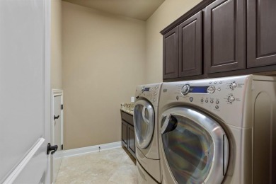 This isn't just a home - it's a lifestyle upgrade.  Step inside on University of Texas Golf Club in Texas - for sale on GolfHomes.com, golf home, golf lot