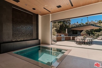 A Contemporary Sanctuary in TarzanaOverlooking the manicured on  in California - for sale on GolfHomes.com, golf home, golf lot