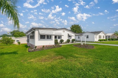 Welcome to this lovely two-bedroom, two-bath home located in the on Orange Blossom Hills Golf and Country Club in Florida - for sale on GolfHomes.com, golf home, golf lot