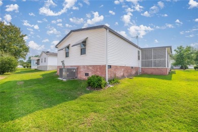 Welcome to this lovely two-bedroom, two-bath home located in the on Orange Blossom Hills Golf and Country Club in Florida - for sale on GolfHomes.com, golf home, golf lot