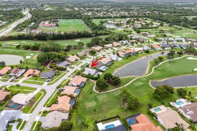 Nestled in the prestigious Boca Woods Country Club, meticulously on Boca Woods Country Club in Florida - for sale on GolfHomes.com, golf home, golf lot