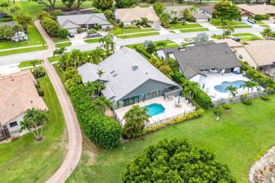 Nestled in the prestigious Boca Woods Country Club, meticulously on Boca Woods Country Club in Florida - for sale on GolfHomes.com, golf home, golf lot