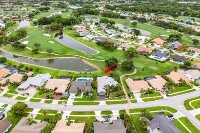 Nestled in the prestigious Boca Woods Country Club, meticulously on Boca Woods Country Club in Florida - for sale on GolfHomes.com, golf home, golf lot