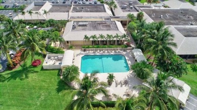 Nestled in the prestigious Boca Woods Country Club, meticulously on Boca Woods Country Club in Florida - for sale on GolfHomes.com, golf home, golf lot