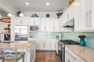 This stunning three-story waterfront residence offers 4 spacious on Palmilla Beach Golf Club in Texas - for sale on GolfHomes.com, golf home, golf lot