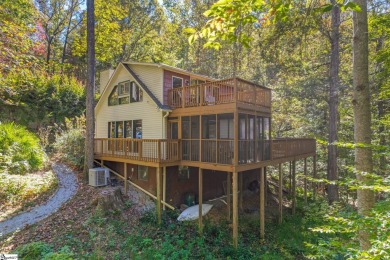 This charming mountain getaway offers a great location for all on The Rock At Jocassee in South Carolina - for sale on GolfHomes.com, golf home, golf lot