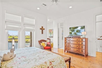 This stunning three-story waterfront residence offers 4 spacious on Palmilla Beach Golf Club in Texas - for sale on GolfHomes.com, golf home, golf lot