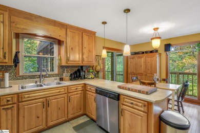 This charming mountain getaway offers a great location for all on The Rock At Jocassee in South Carolina - for sale on GolfHomes.com, golf home, golf lot