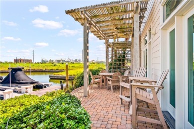 This stunning three-story waterfront residence offers 4 spacious on Palmilla Beach Golf Club in Texas - for sale on GolfHomes.com, golf home, golf lot