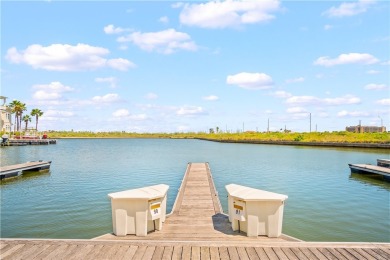 This stunning three-story waterfront residence offers 4 spacious on Palmilla Beach Golf Club in Texas - for sale on GolfHomes.com, golf home, golf lot