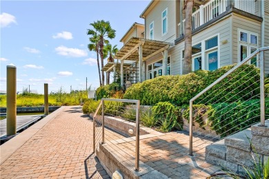 This stunning three-story waterfront residence offers 4 spacious on Palmilla Beach Golf Club in Texas - for sale on GolfHomes.com, golf home, golf lot