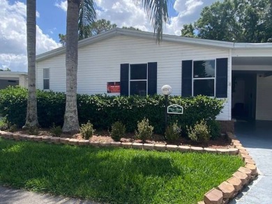 Discover this stunning triple-wide manufactured home in on Schalamar Creek Golf and Country Club in Florida - for sale on GolfHomes.com, golf home, golf lot