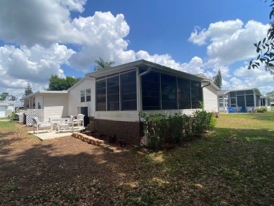 Discover this stunning triple-wide manufactured home in on Schalamar Creek Golf and Country Club in Florida - for sale on GolfHomes.com, golf home, golf lot