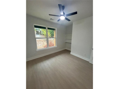 This open floorplan 2 bedroom, 2 bath house is beautiful! on Bella Vista - Metfield Golf Complex and Country Club in Arkansas - for sale on GolfHomes.com, golf home, golf lot