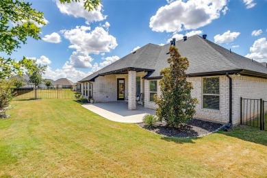 From the moment you approach the driveway, this home in the on Harbor Lakes Golf Club in Texas - for sale on GolfHomes.com, golf home, golf lot