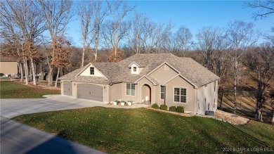 This exceptional residence has a wall of windows providing a on Osage National Golf Club in Missouri - for sale on GolfHomes.com, golf home, golf lot