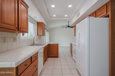 This well-maintained Capistrano offers vaulted ceilings that on Echo Mesa Golf Course in Arizona - for sale on GolfHomes.com, golf home, golf lot