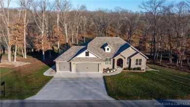 This exceptional residence has a wall of windows providing a on Osage National Golf Club in Missouri - for sale on GolfHomes.com, golf home, golf lot