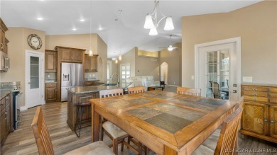 This exceptional residence has a wall of windows providing a on Osage National Golf Club in Missouri - for sale on GolfHomes.com, golf home, golf lot