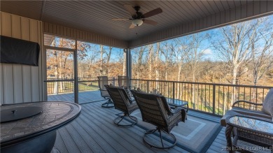 This exceptional residence has a wall of windows providing a on Osage National Golf Club in Missouri - for sale on GolfHomes.com, golf home, golf lot