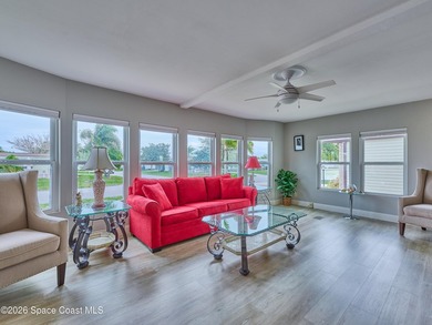 Beautifully updated home offering spacious, relaxed living with on Barefoot Bay Golf Course in Florida - for sale on GolfHomes.com, golf home, golf lot